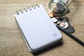 Note pad, pencil and coins Royalty Free Stock Photo