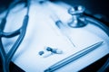 Note pad with stethoscope and pen along Royalty Free Stock Photo