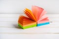 Note pad of sticky notes open like an fan, office stationery. Copy space Royalty Free Stock Photo