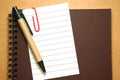 Note paper clip on notebook with pen Royalty Free Stock Photo