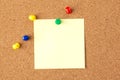 Note paper pined on brown cork board background. creative photo. Royalty Free Stock Photo