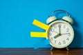 Note paper sticky and vintage alarm clock on table with copy space for add text notice something, list memo and schedule concept