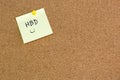 Note paper with word Happy birthday on brown notice cork board Royalty Free Stock Photo