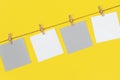 Note papers and decorative pin or clip isolated on yellow background. Office mock up Royalty Free Stock Photo