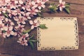 Note, postcard, writing retro peach blossoms on a wooden vintage