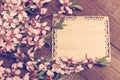 Note, postcard, writing retro peach blossoms on a wooden vintage