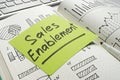 Note with sales enablement in a notebook with records. Sales strategy. Royalty Free Stock Photo