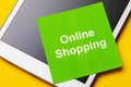 Note with text and tablet. Concept on the topic of online shopping Royalty Free Stock Photo