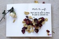 Note to self concept with motivational words - Do not just be good to other. Be good to yourself too. Dried roses on paper book.