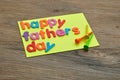 A note with the word happy fathers day and golf tees