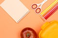 Notebook, apple, scissors, color pencils and lunch box. School supplies Royalty Free Stock Photo