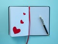 Notebook ballpoint pen hearts. Valentine's day concept. Royalty Free Stock Photo