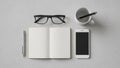 Above are black framed glasses and a white mug with a pen inside Royalty Free Stock Photo