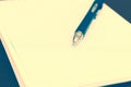 The notebook in the box with pen closeup, toned Royalty Free Stock Photo