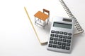 Notebook, calculator, pencil and miniature desk Royalty Free Stock Photo