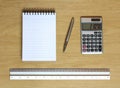 Notebook calculator ruler and pen on desk Royalty Free Stock Photo