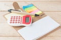 Notebook, Calculator, On Wood Background, Selective Focus. Royalty Free Stock Photo