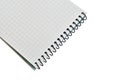 Notebook with checkered sheets and spring binding. Royalty Free Stock Photo