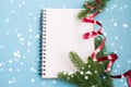 Notebook and Christmas tree branches. Christmas planning concept. Place for text. Christmas and New Year`s composition. Royalty Free Stock Photo