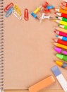 Notebook closeup with colored pencils Royalty Free Stock Photo