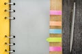 Notebook with colorful sticky bookmarks Royalty Free Stock Photo