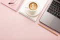 Notebook, a cup of coffee with a beautiful pattern and a notepad on a pink background. Place for text Royalty Free Stock Photo