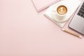 Notebook, a cup of coffee with a beautiful pattern and a notepad on a pink background. Place for text Royalty Free Stock Photo