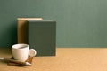 Notebook and cup coffee on brown desk. green wall background. retro style Royalty Free Stock Photo