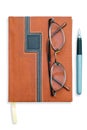 Notebook or diary, glasses and pen