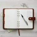 The notebook features a buttoned strap closure and a leather bookmark Royalty Free Stock Photo