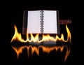 Notebook in fire flame Royalty Free Stock Photo