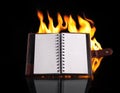 Notebook in fire flame Royalty Free Stock Photo