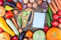 Notebook And Fresh Vegetables Background On Wooden Table. Royalty Free Stock Photo