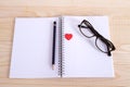 Notebook glasses pencil heart.