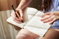 Notebook, hands and woman with pen, journal and reflection with creative, ideas and thinking for writing. Writer closeup