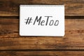 Notebook with hashtag METOO on background, top view. Stop sexual assault