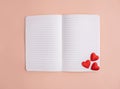 Notebook with hearts on a light background. Valentine\'s Day. Greeting card. Flat lay, top view. Royalty Free Stock Photo