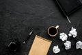 Notebook, ink, dip pen, coffee for writer workplace set on black office background top view mock-up