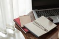 Notebook and laptop computer on wood table Royalty Free Stock Photo