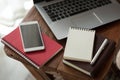 Notebook and laptop computer on wood table Royalty Free Stock Photo