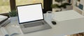 Notebook laptop white screen mockup on white table. Modern office desk workspace Royalty Free Stock Photo