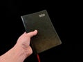 Notebook - a leather-bound diary, on a black background. Notebook for time planning Royalty Free Stock Photo