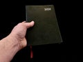 Notebook - a leather-bound diary, on a black background. Notebook for time planning Royalty Free Stock Photo