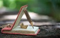 Notebook made from old paper, wood pencil  and  paper boat on nature background. Mock up education concept Royalty Free Stock Photo