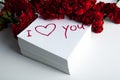 Notebook with marker inscription I love you and roses