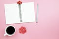 Notebook mobile phone and black coffee white cup on pink background pastel style with copyspace flatlay topview.