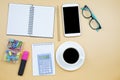 Notebook mobile phone calculator and black coffee white cup blue Royalty Free Stock Photo