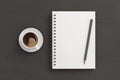 Notebook mockup. Blank notebook, coffee and pencil. Spiral notepad on dark wooden desk Royalty Free Stock Photo