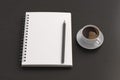 Notebook mockup. Blank notebook, coffee and pencil. Spiral notepad on dark wooden desk Royalty Free Stock Photo