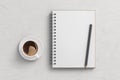 Notebook mockup. Blank notebook, coffee and pencil. Spiral notepad on white wooden desk Royalty Free Stock Photo